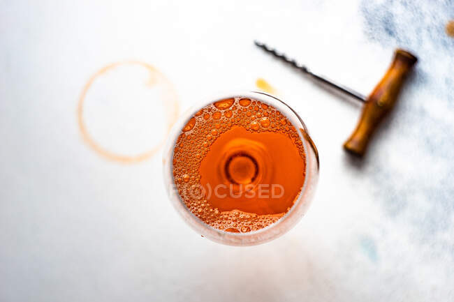 A closeup shot of a glass of cinnamon and a spoon with a wooden handle — Stock Photo