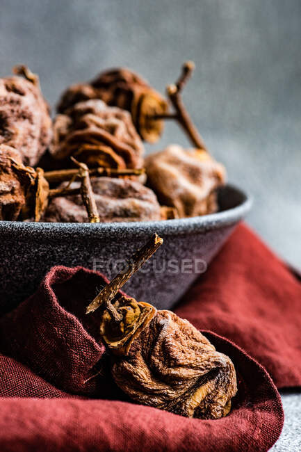Dried fruits and cinnamon on wooden table — Stock Photo