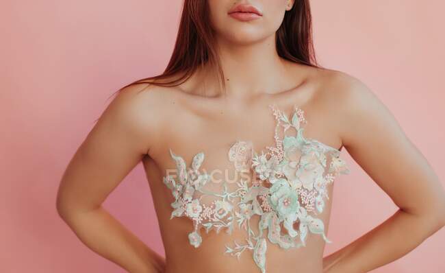 Close-Up of a woman with lace covering her breasts — Stock Photo
