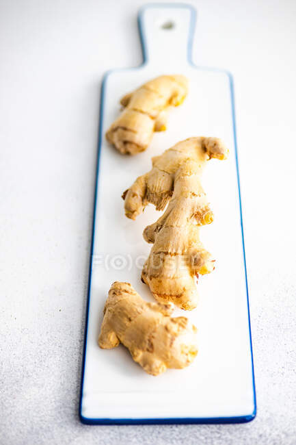 Fresh ginger root on white background — Stock Photo