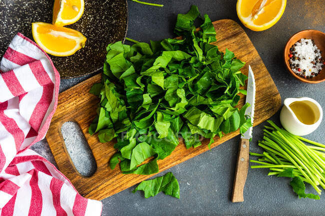 Fresh raw vegetables and herbs on a wooden board. top view. free space for text. — Stock Photo