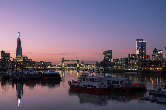 City skyline and Tower Bridge at night, London, England, UK — Stock Photo