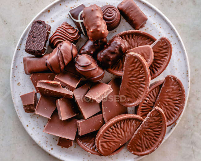 Plate of assorted chocolates and pralines — Stock Photo