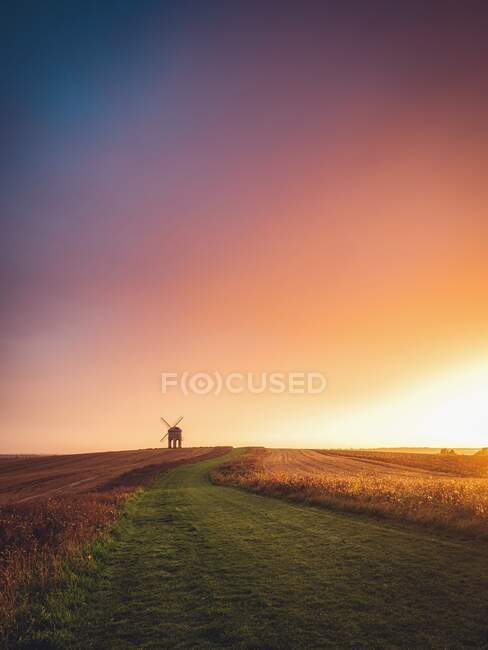 Traditional windmill in rural landscape at sunrise, Warwickshire, England, UK — Stock Photo