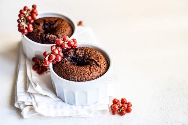 Two chocolate fondant cakes with buffaloberries — Stock Photo