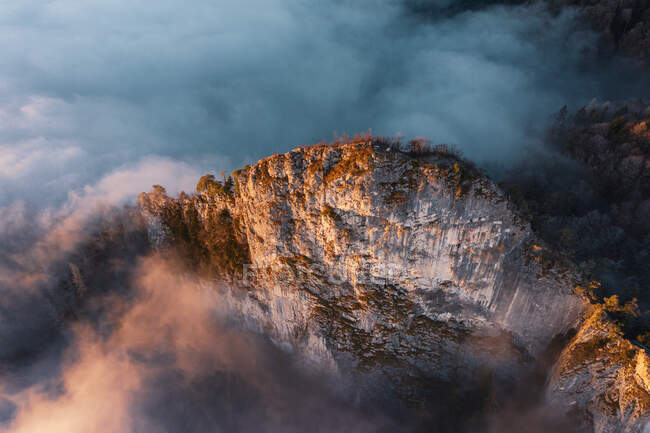 Aerial view of a mountain ridge rising through the clouds, Hallein, Salzburg, Austria — Stock Photo