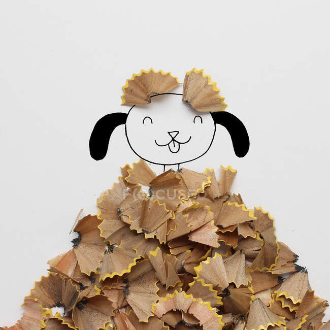 Conceptual perro en una pila de hojas de otoño - foto de stock