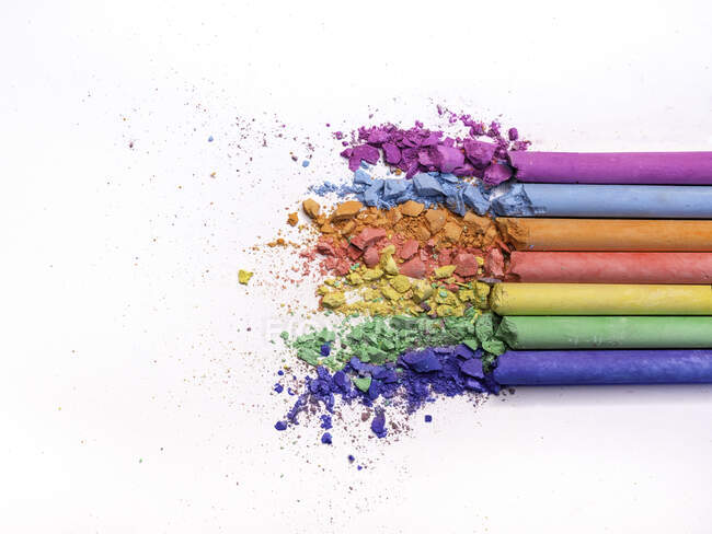 Row of multi coloured crushed  chalks — Stock Photo