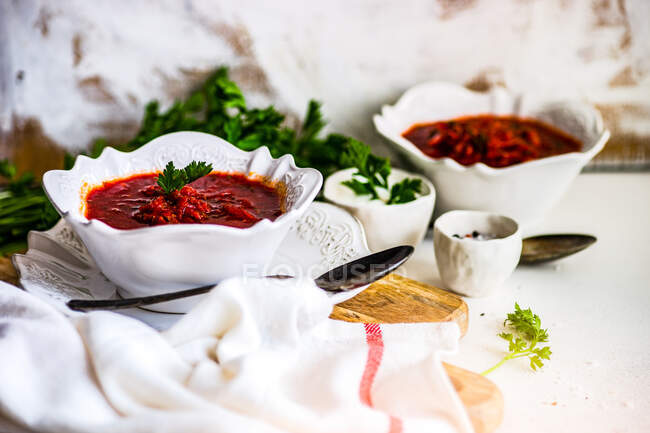 Traditional ukrainian beetroot soup Red Borscht served in a bowl on rustic table — Stock Photo