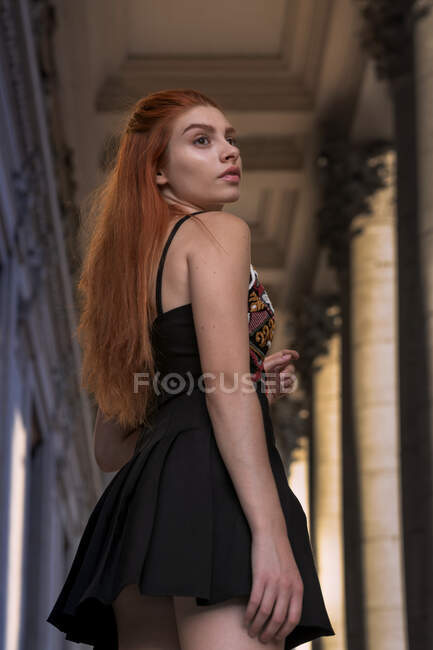 Portrait of a woman with long red hair standing in city, Rome, Lazio, Italy — Stock Photo