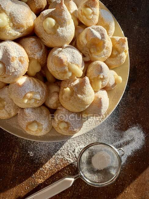 Overhead view of freshly baked mini eclairs — Stock Photo