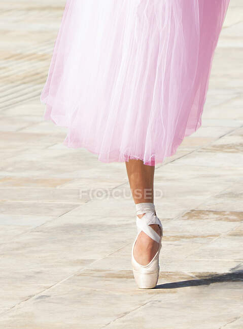 Close-up of a ballerina standing en pointe in the street, Malta — Stock Photo