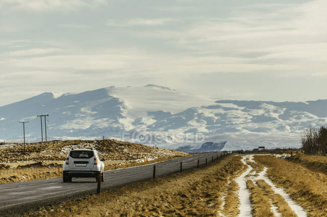 Car driving towards the mountains, Iceland — Stock Photo