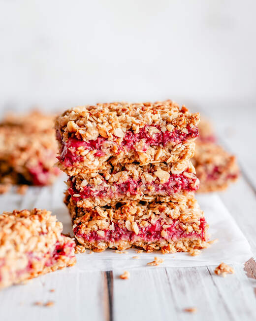 Stack of Raspberry oat crumble slices — Stock Photo