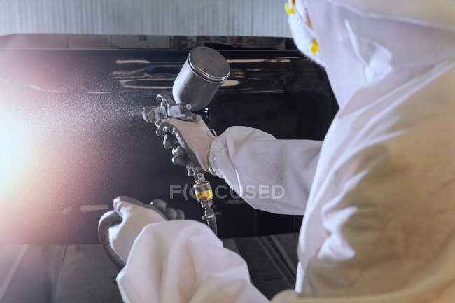 Mechanic spray painting a car, Thailand — Stock Photo