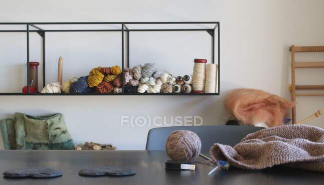 Close-up of knitting on a table in a dining room — Stock Photo