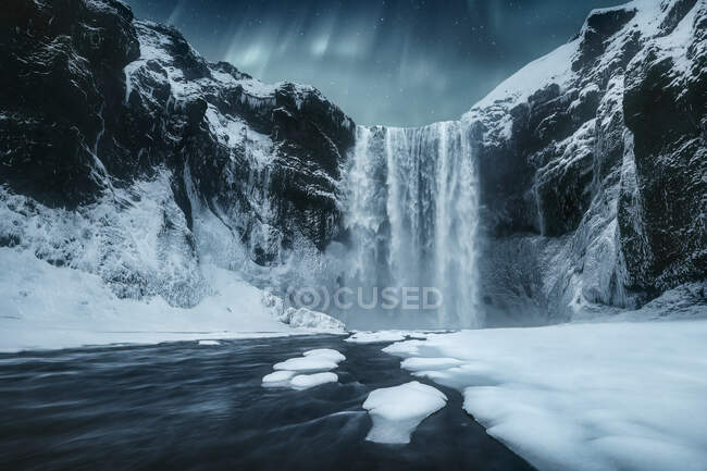 Skogafoss waterfall at night, Skogar, South Central Iceland, Iceland — Stock Photo