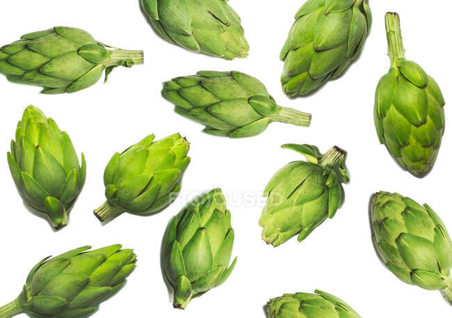 Fresh artichokes on white background with copy space — Stock Photo