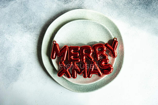 Merry Xmas decoration on a plate — Stock Photo