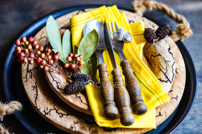 Rustic Thanksgiving place setting with dried fruit on a wooden table — Stock Photo