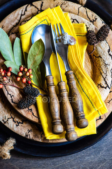 Rustic Thanksgiving place setting with dried fruit on a wooden table — Stock Photo