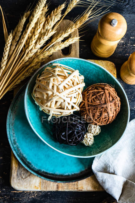 Rustic autumn table setting with ornamental balls — Stock Photo