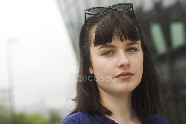 Portrait of a serious woman standing outdoors in the city, Germany — Stock Photo