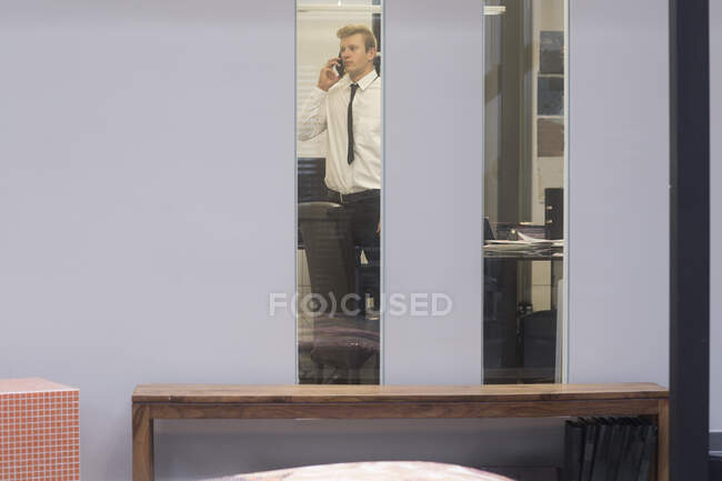 Salesman in an office talking on the phone, Germany — Stock Photo