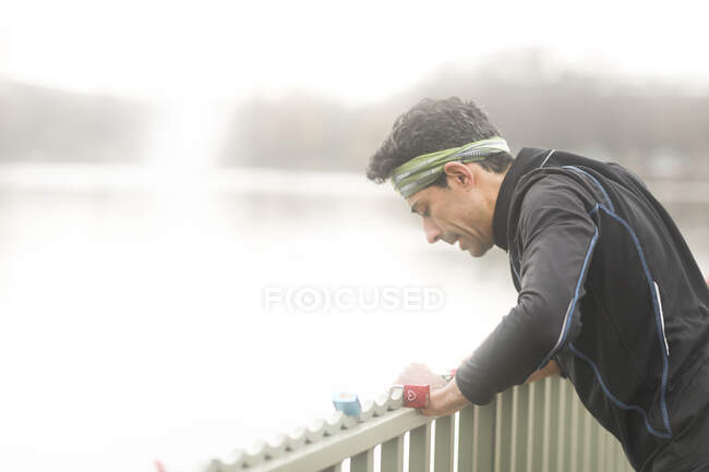 Tired jogger standing outdoors taking a break, Germany — Stock Photo