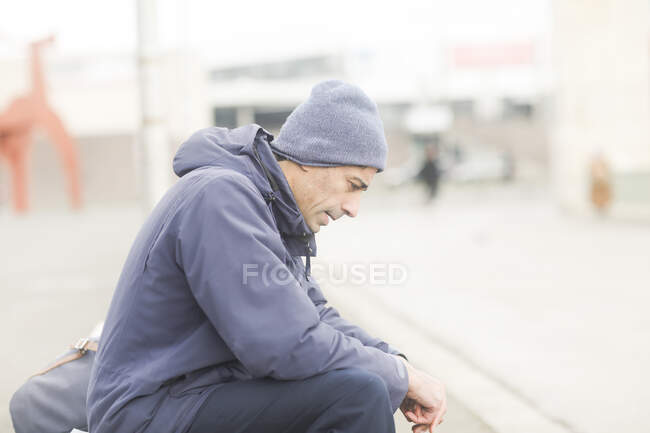 Man sitting on a bench thinking, Germany — Stock Photo