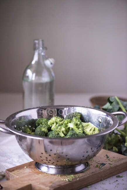 Broccoli in a colander — Stock Photo