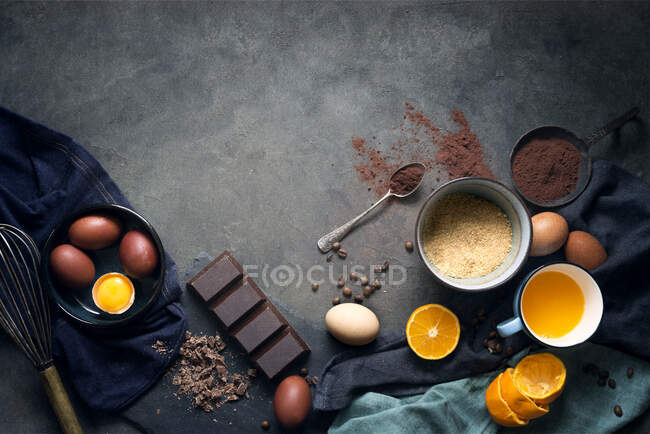 Ingredients to make a chocolate orange cake — Stock Photo