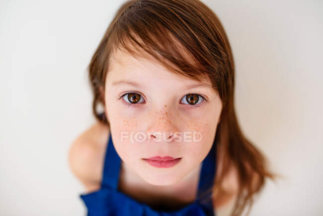 Portrait of a serious girl with freckles — Stock Photo