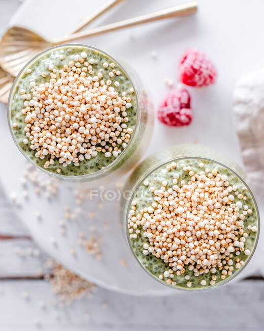 Overhead view of two Matcha chia puddings topped with quinoa puffs — Stock Photo