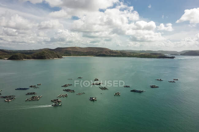 Aerial view of traditional floating fishing cages, Gerupuk Bay, Lombok, Indonesia — Stock Photo