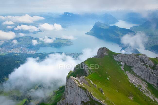 Mountain Landscape through the fog and  clouds from Mt Pilatus, Lucerne, Switzerland — Stock Photo