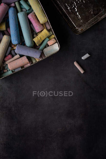 Multi coloured chalk in a metal box — Stock Photo