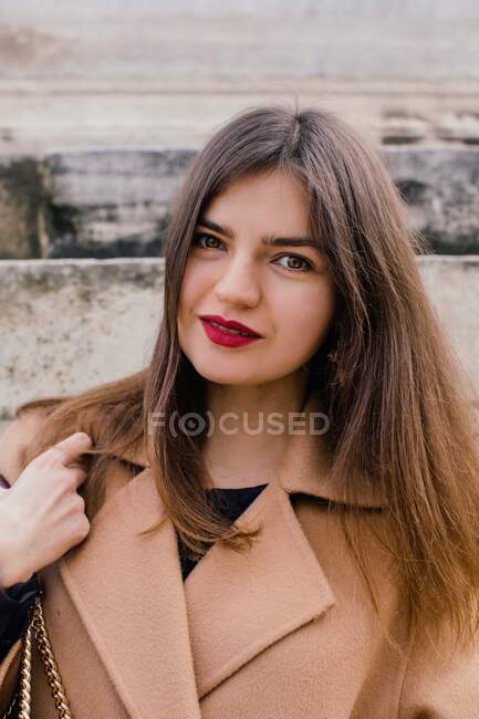 Portrait of stylish woman standing by a wall waiting, Rome, Lazio, Italy — Stock Photo