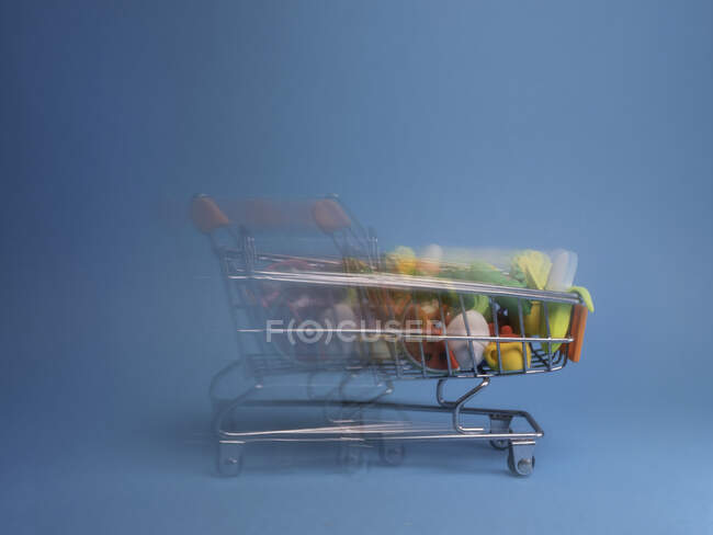 Shopping trolley moving at speed — Stock Photo