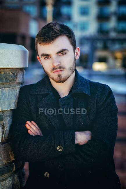 Portrait of young stylish man standing outdoors — Stock Photo