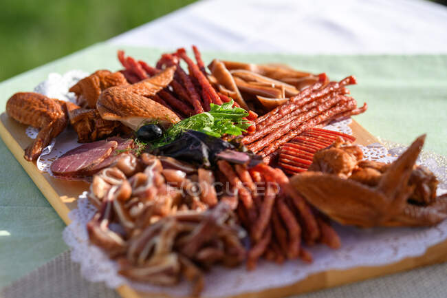 Smoked sausage, chicken and meat board — Stock Photo