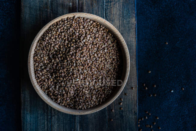 Chia seeds in a bowl on a wooden background. top view. — Stock Photo