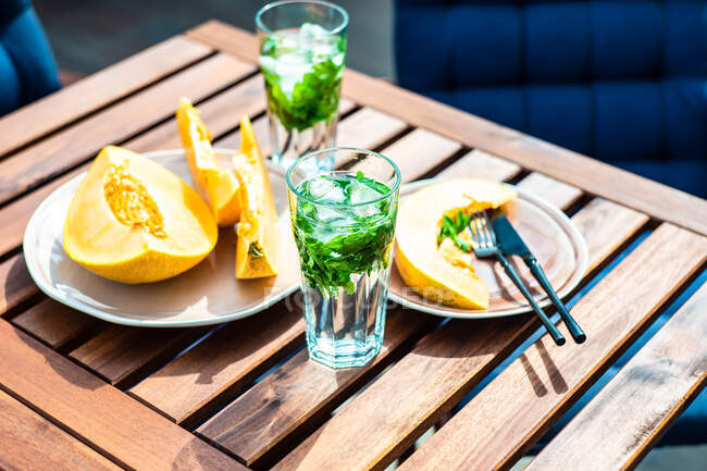 Glasses of mint water with honeydew melon — Stock Photo