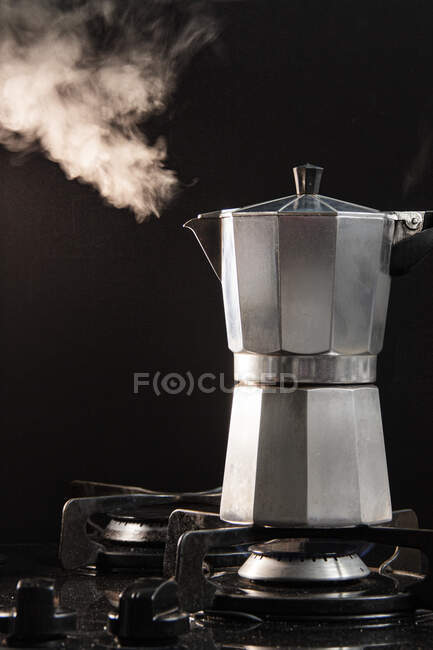 Steaming Moka Pot on a gas stove — Stock Photo