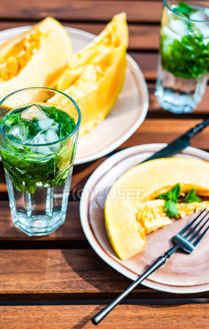 Tasty zucchini pancakes with cheese and mint — Stock Photo