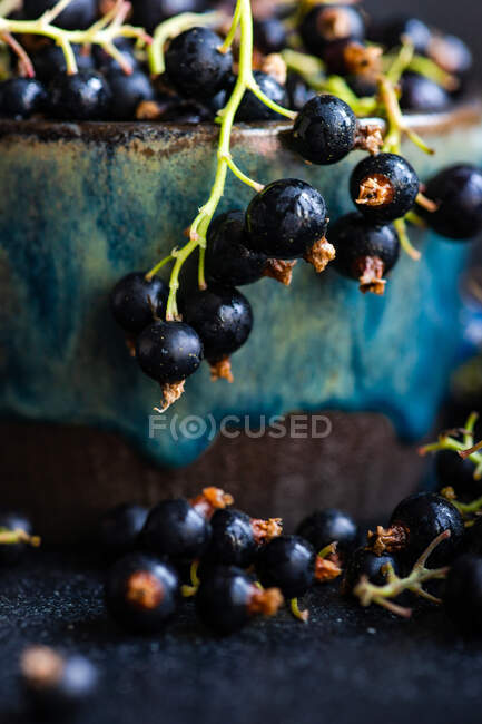Black currant on a wooden table — Stock Photo