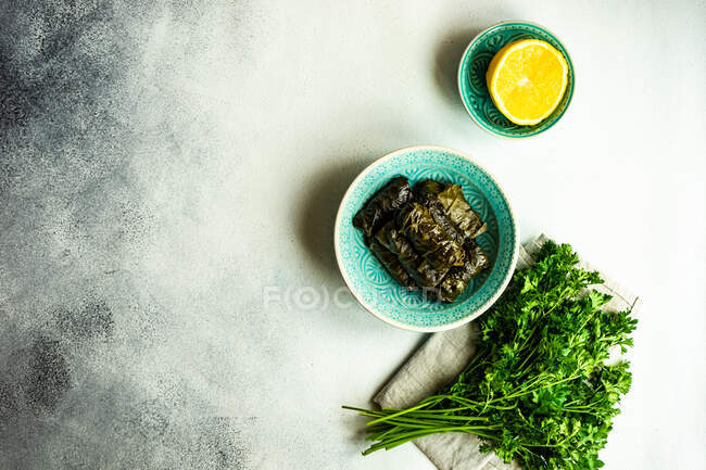 Traditional Georgian tolma dish with parsley and lemon — Stock Photo