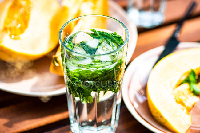 Glass of mint water with honeydew melon — Stock Photo