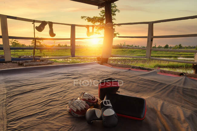 Leather boxing gloves in an outdoor boxing ring, Thailand — Stock Photo