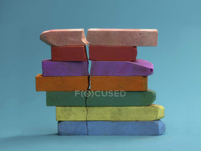 Stack of multi coloured chalk with a crack in — Stock Photo